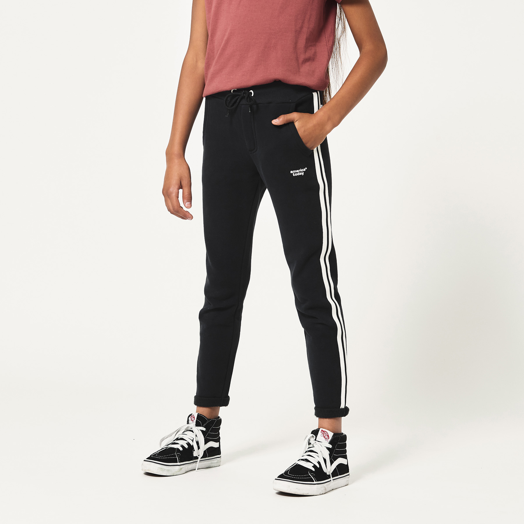 grey nike joggers with black stripe